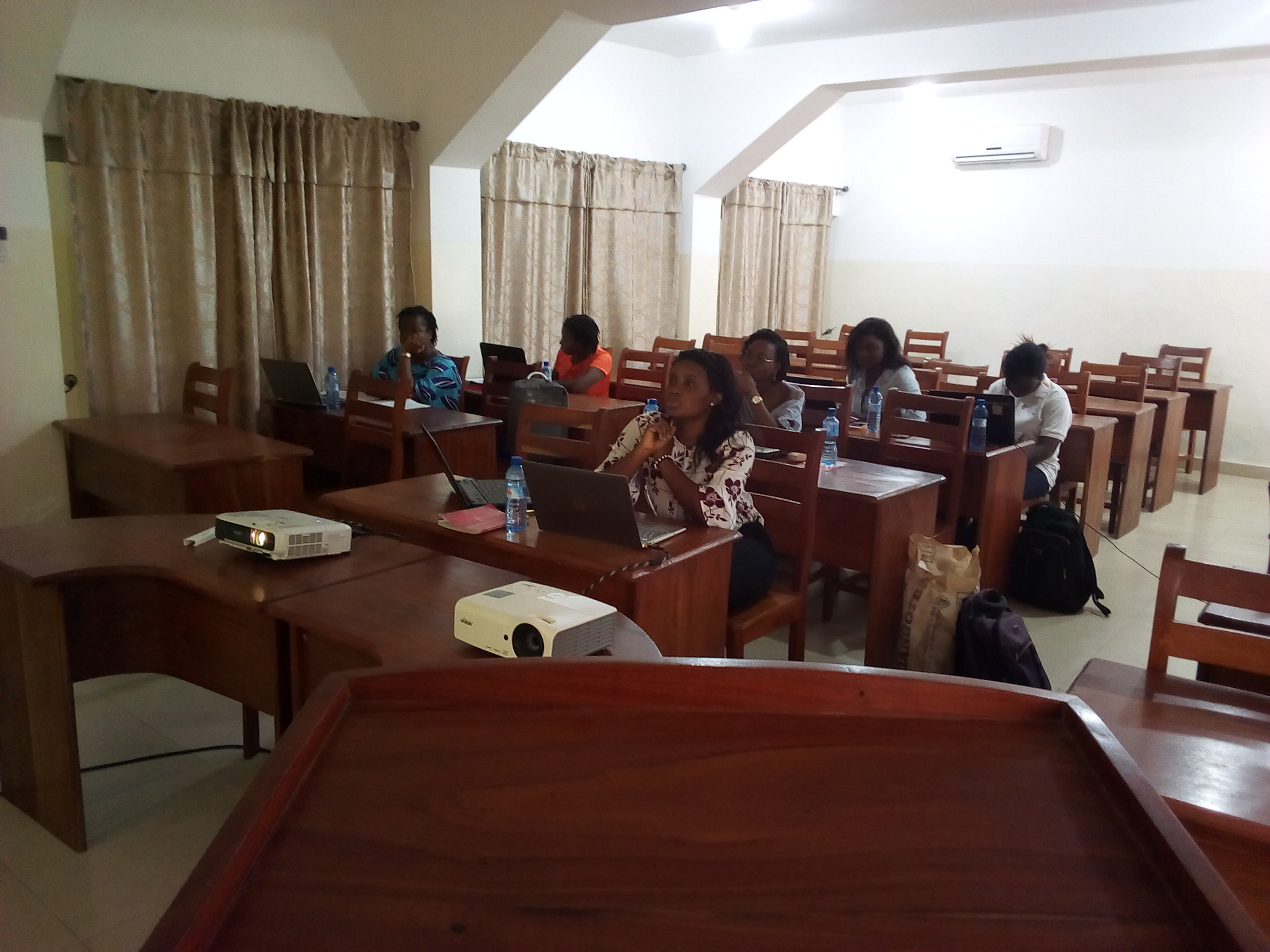 The second meetup speaker, Ruth Ouangbey, is taking us through a review of the most practical methods of importing and exporting datasets. The members are following and taking notes.